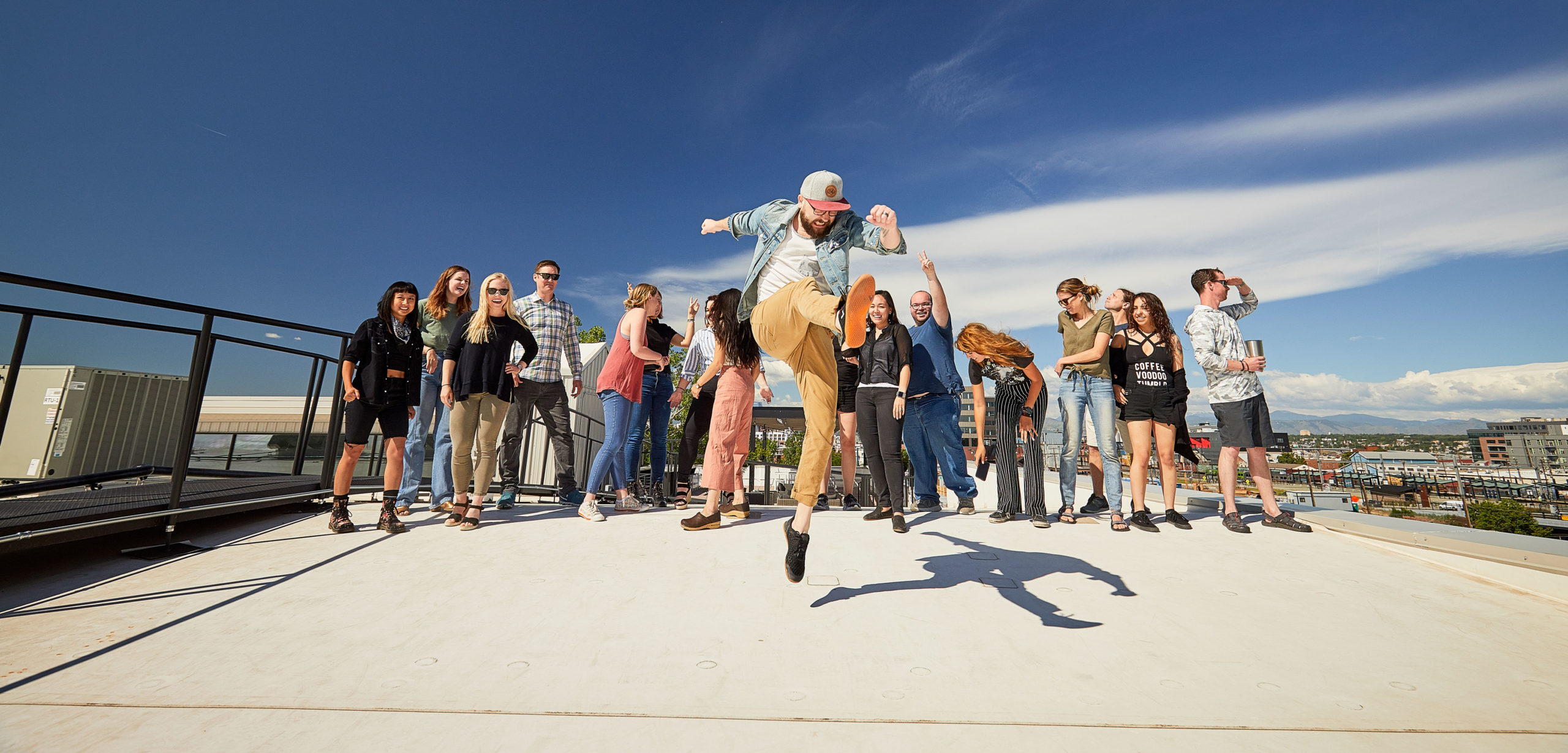 I kick triumphantly, on a roof, before my 11th design class